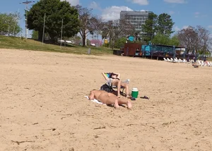 Girl laying out getting sun in a white thong bikini