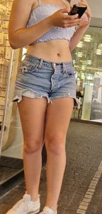 Adorable cute candid teen wearing a top and fringe jean shorts street creepshots, nice tummy and legs