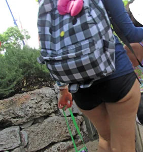 Girl with slight cheeks in little spandex shorts