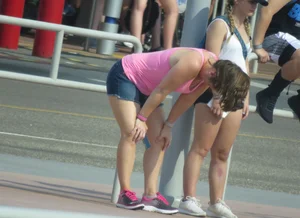 Couple of babes standing around in shorts