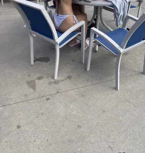 White bikini at table by pool