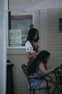 Two sexy Tilted Kilt employees showing cleavage and cheeks