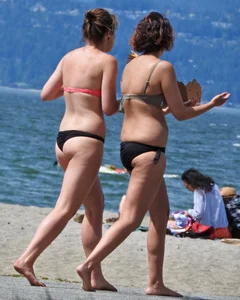 Group of sexy girls in bikinis at the beach