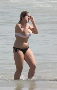 Big boobed thick blonde on the beach in a bikini