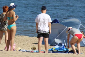 Couple of hot babes hanging out at the beach in bikinis