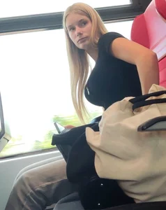 Hot busty blonde on train