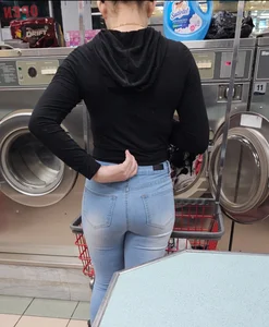 Hot latina in tight jeans at the laundromat
