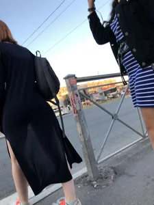 Teen wearing black dress which becomes transparent