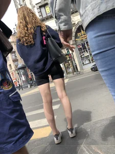 Great legs and booty in spandex shorts of a street candid girl crossing the street