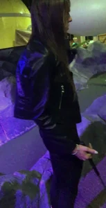 Skinny girl in a leather jacket and leggings playing mini-golf creepshots