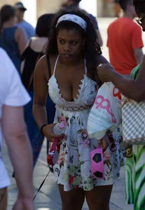 Black girl showing major cleavage in dress and almost upskirted