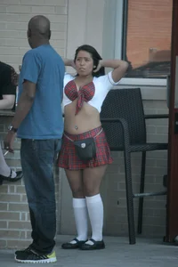 Two sexy Tilted Kilt employees showing cleavage and cheeks