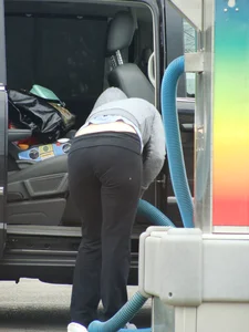 Girls cleaning their cars in jeans and pants