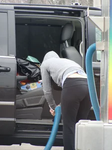 Girls cleaning their cars in jeans and pants