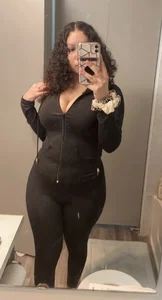 Chubby girl in leggings bathroom mirror selfie