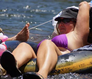 Sexy party girls in bikinis on a lake