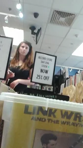 Girl at the record store in shorts with a nice booty and vpl