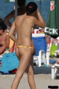 Beach voyeur girls in bikinis, thongs and topless