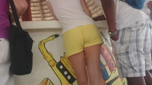 Milf in yellow shorts with vpl and a wedgie