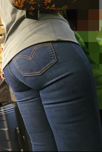 Juicy MILF in tight dark blue Jeans.