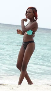 Candid black family, milf and teens on the beach in bikinis