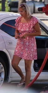 Sexy blonde upskirted in pink dress while cleaning her car