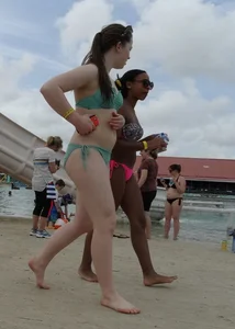 Sexy black girl in bikini and short shorts with a cute friend with braces
