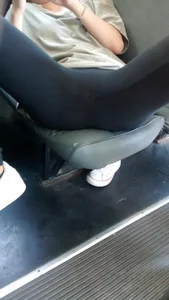 Girl Lying on the Bus Seat in Leggings With Widely Spread Legs Creepshot