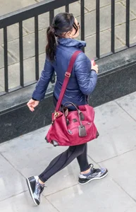 Brunette lady in leggings out walking