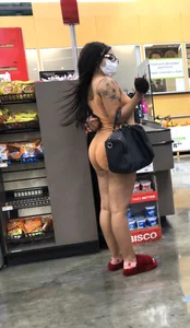 Latina with hard nipples and a big booty in tight spandex shorts outfit