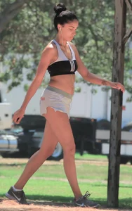 Ebony babe in Hooters shorts out for a run and walk