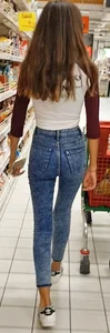 Awesome chick wearing tight blue jeans at the supermarket