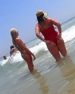 Thick big booty girl in a swimsuit with blonde friend in a bikini