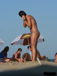 2 topless thonged sexy friends on the beach with great bodies