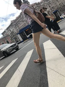 Young Girl in Shorts And Sandals Crossing the Street Gallery