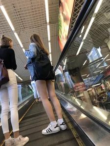 Hot Girls on the Mall Travelator in Mini Shorts and Her Friend in White Pants - Skinny Hot Legs Creepshots