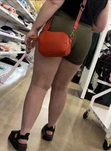 Juicy brunette in green spandex shorts OC