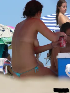 2 topless thonged sexy friends on the beach with great bodies