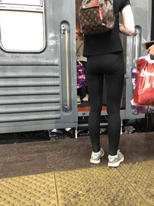Teen Girl in Tights And Sneakers Standing on the Train Platform VPL Photos