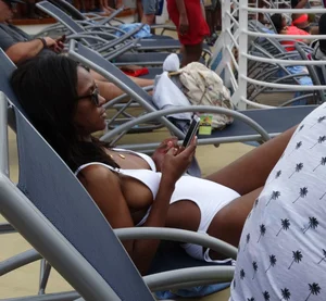 Sexy Ebony babe on a cruise in white bikini