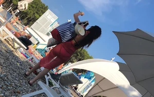 Sexy girl at the pool in pink bikini