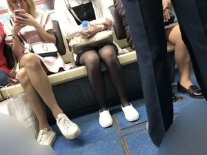 Candid Girl in Sunglasses And Black Pantyhose With Hot Thin Legs Sitting in a Subway Train Creepshots