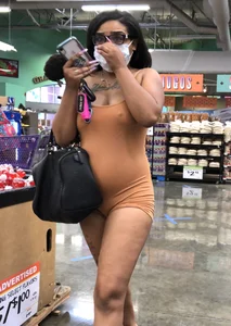 Latina with hard nipples and a big booty in tight spandex shorts outfit
