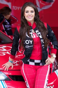 Beautiful and sexy Toyota car girl in red leggings