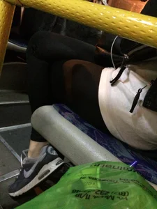 Teen with Crossed Skinny Legs in Leggings Sitting in a Bus Candid