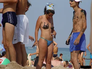 Beach voyeur girls in bikinis, thongs and topless