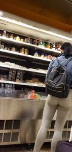 Beautiful brunette shopping in tight grey spandex with a great ass