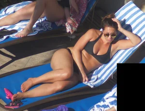 Milf laying out in black bikini by the pool