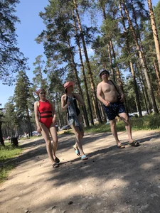Young Girl in a One-Piece Swimsuit Walking on a Forest Road Photo Gallery