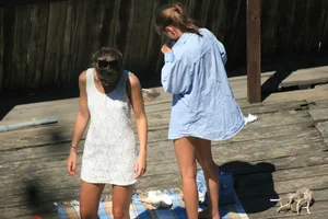 Two teens stripping and going topless to tan